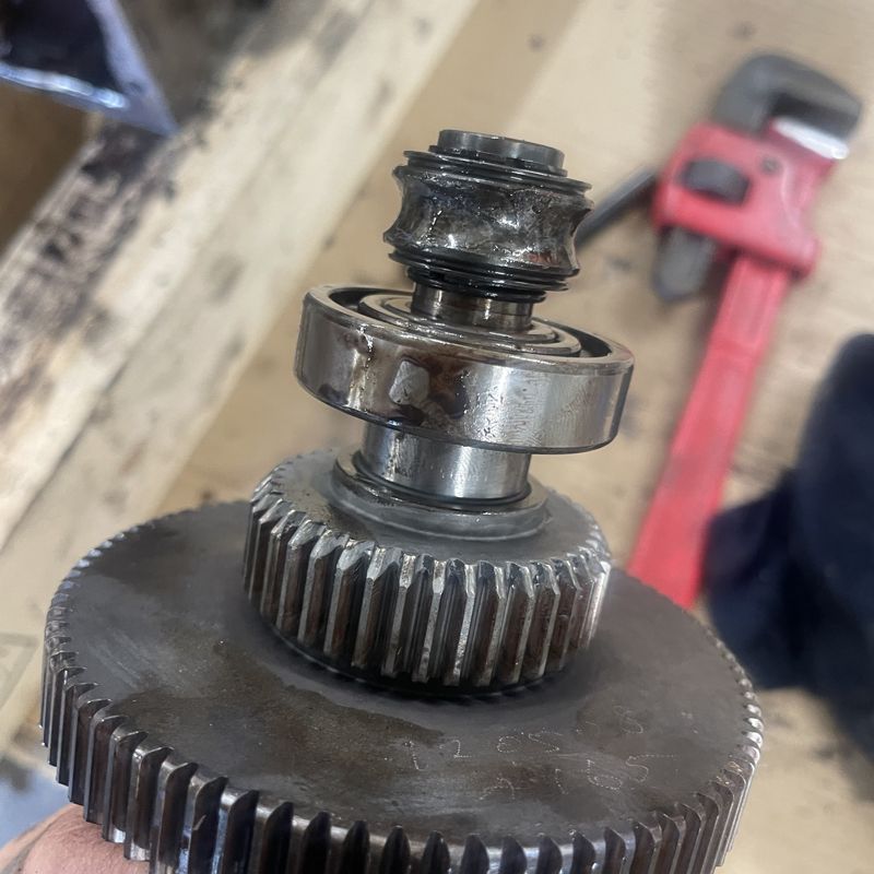 Worn gear shaft with a damaged bearing