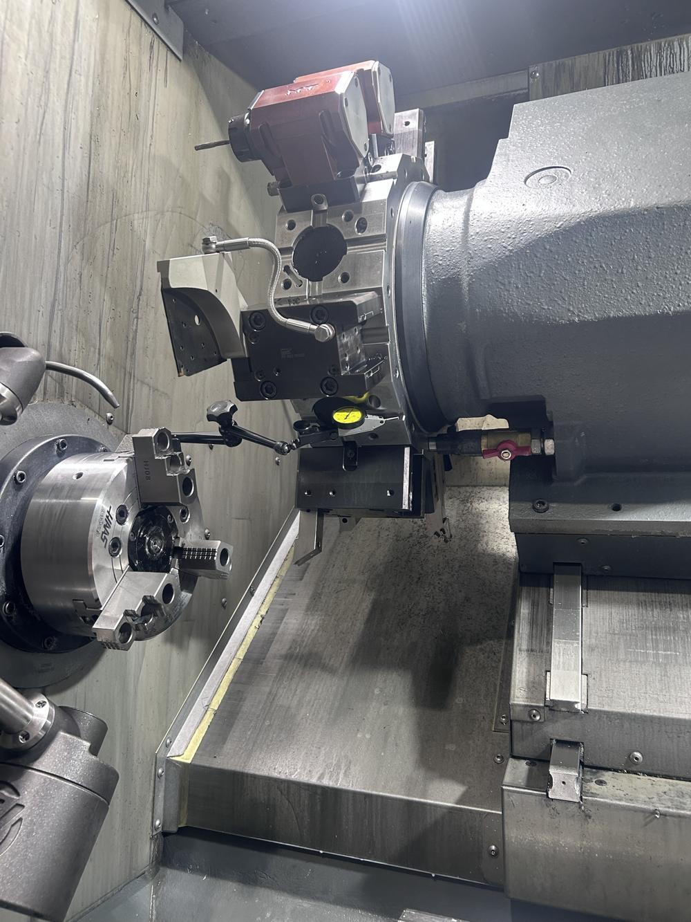A dial test indicator set up on a CNC lathe turret